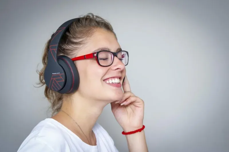 PowerLocus wireless headphones displayed on a desk setup